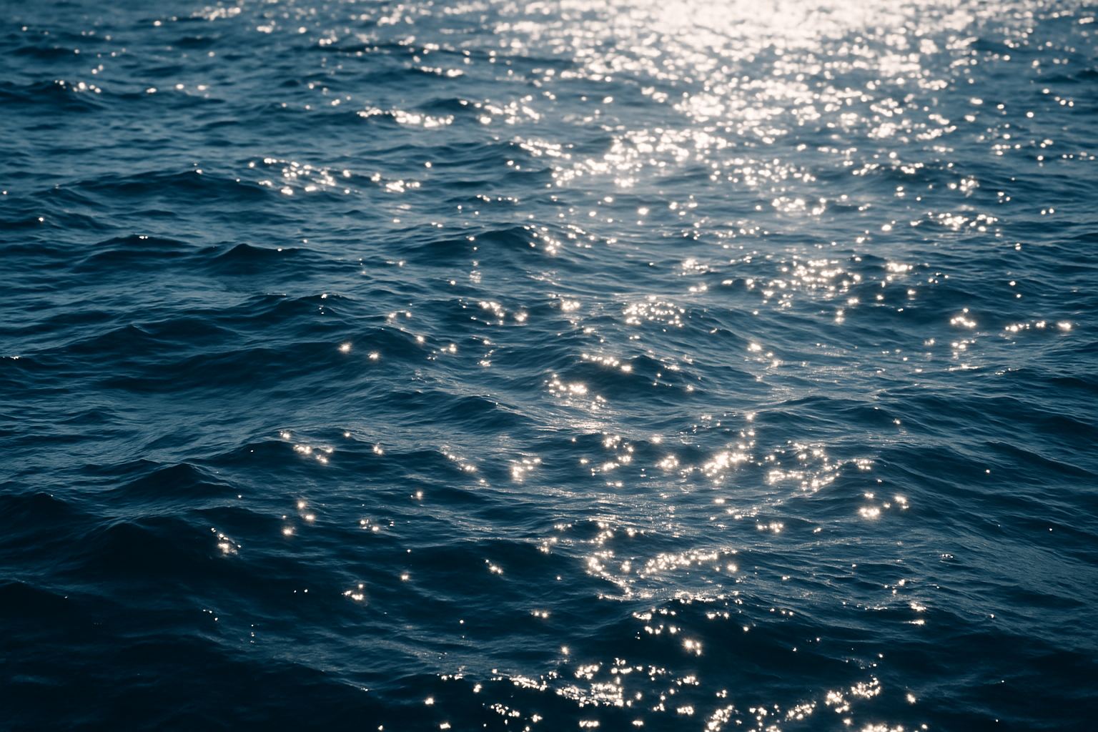Sun glare scattering across a moving water surface. The light arriving at your face is not only the light coming from above.